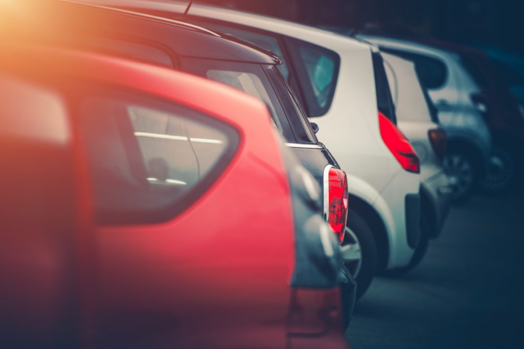 Full of Cars Car Parking Concept Photo. Row of Modern Vehicles Side by Side Parked.